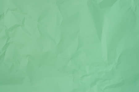 crumpled greenpaper background textureの写真素材