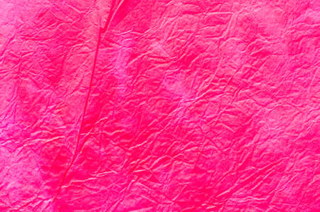 red painted paper tissue backgroundの写真素材