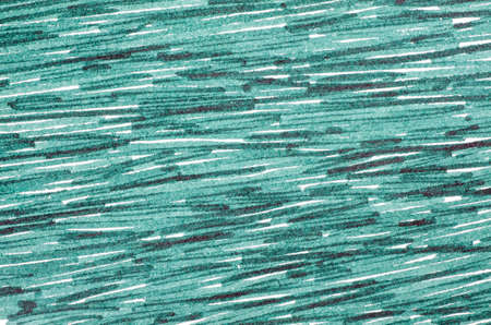 green marker doodles on white paper backgroundの写真素材