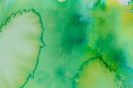 green watercolor painted background textureの写真素材