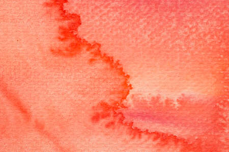 red watercolor painted on paper background textureの写真素材