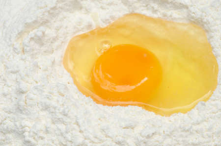 baking ingredients flour and eggの写真素材