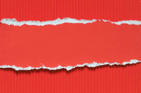 red torn corrugated paper background textureの写真素材