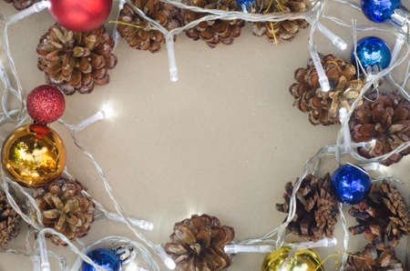 Christmas decoration with lights and pine conesの写真素材