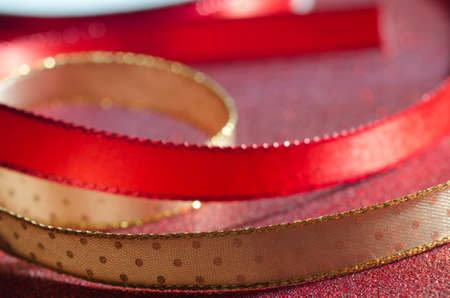 closeup to decorative golden  and red ribbonの写真素材