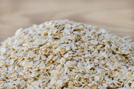heap of raw oat flakes