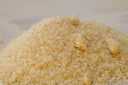 heap of brown cane crystallized sugar