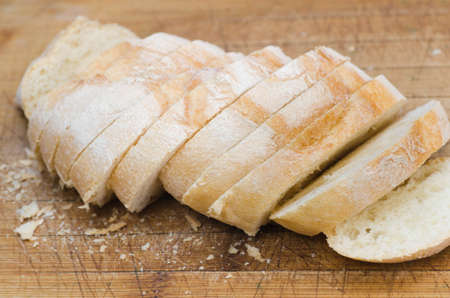 sliced bread on wooden backgroundの写真素材