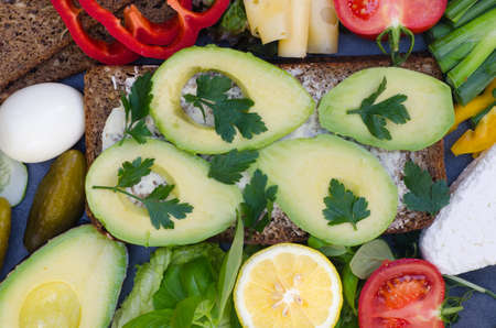 healthy sandwich with avocado on table
