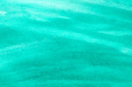 turquoise watercolor painted on paper background textureの写真素材