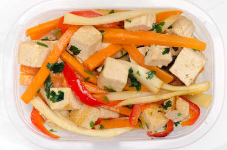 fried tofu with vegetabled in plasatic boxの写真素材