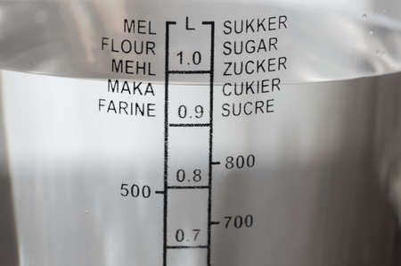 plastic kitchen measuring cup with waterの写真素材