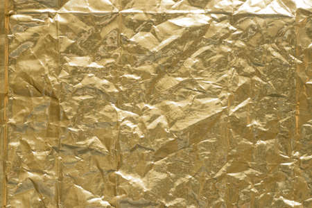 creased gold creased metallic foil background texture