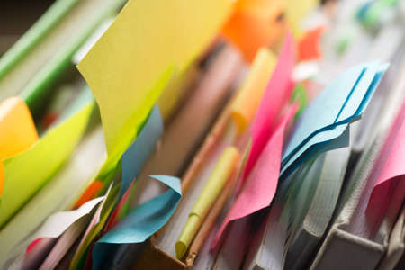 group of books and notebooks with multicolored stickersの写真素材