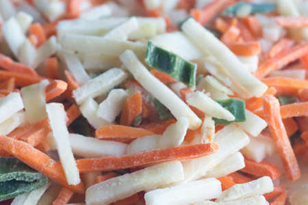 closeup to group of frozen vegetablesの写真素材