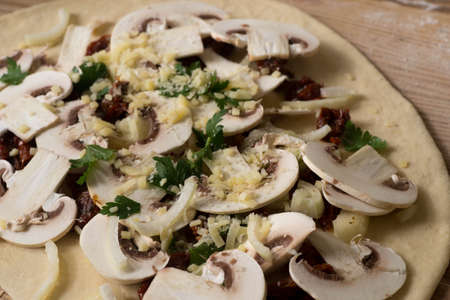 closeup to homemade raw pizzaの写真素材