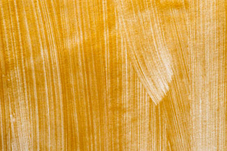 golden color painted background textureの写真素材