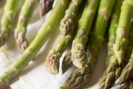 closeup to fresh raw green asparagusの写真素材