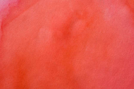 red watercolor painted on paper backgroundの写真素材