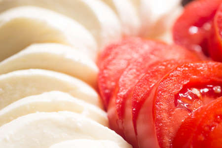 tomato and mozzarella on plateの写真素材