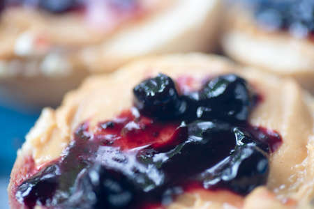 healthy small open sandwich with peanut butter and jelly selective focus macroの写真素材