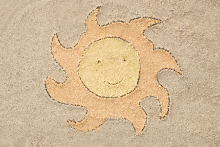 Sun drawing in sand background