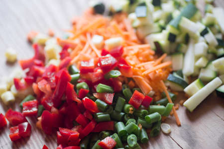 Chopped vegetables selective focus on wooden boardの写真素材