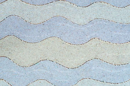 wave pattern drawing in sand backgroundの写真素材