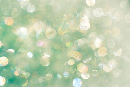 green color blurred background with bokeh lightsの写真素材