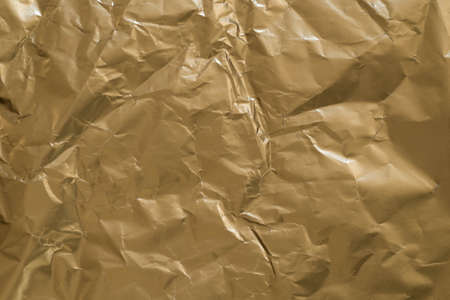 gold color creased paper texture background