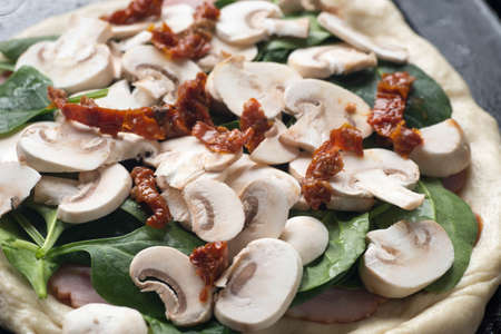 raw pizza and igredients closeupの写真素材