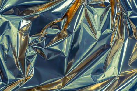 silver  color folded metallic foil abstract bacgkgroundの写真素材