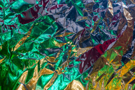 multicolored color creased metallic foil abstract bacgkgroundの写真素材