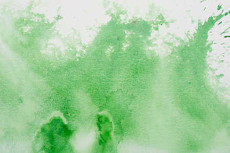 green color watercolor painting on white paper background textureの写真素材