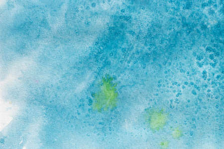 blue color watercolor painting on white paper background textureの写真素材