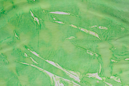 green color watercolor painted on paper background textureの写真素材