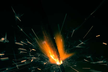 Christmas sparkler fire in dark closeup