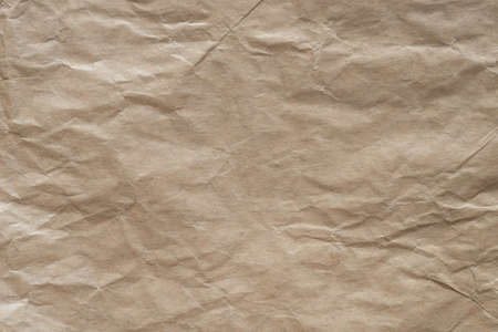 brown creased paper background texture closeupの写真素材