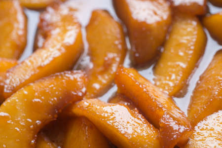 fried in sugar carmelised pieces of quince macroの写真素材