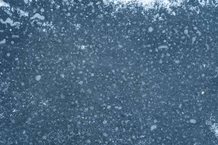 blue ice with snow background textureの写真素材