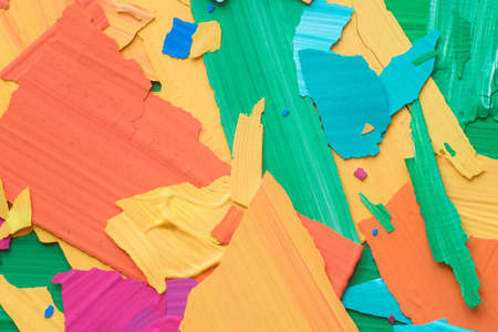 pieces of multicolored peeled paint macro backgroundの写真素材