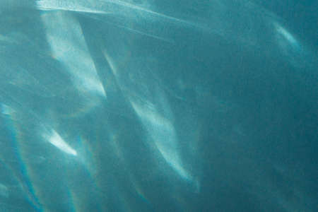 light glints on blue color paper background textureの写真素材