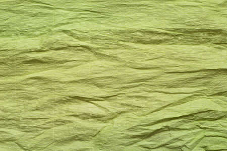 creased crepe green color paper background textureの写真素材