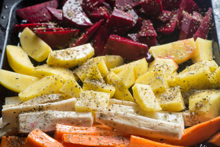 raw chopped vegetables for baking in ovenの写真素材