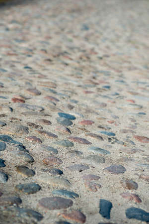 old dirty paving stones road selective focusの写真素材