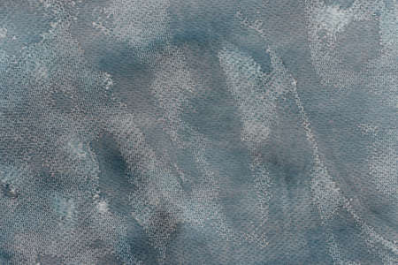 gray watercolor color painted on paper background textureの写真素材