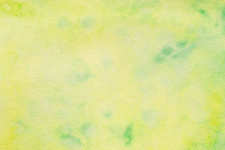 greenish watercolor color painted on paper background textureの写真素材