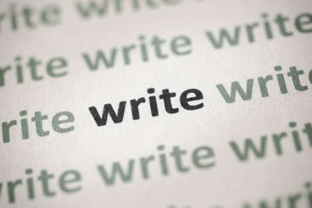word language printed on white paper macroの写真素材