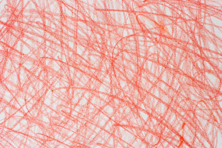 red crayon doodles on white paper background textureの写真素材