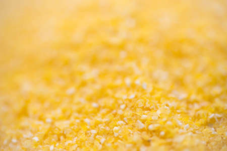 heap of maise grits groats macro selective focusの写真素材